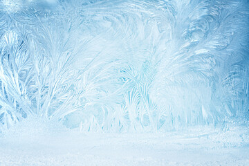 Intricate Frost Crystal Patterns on Icy Blue Winter Background