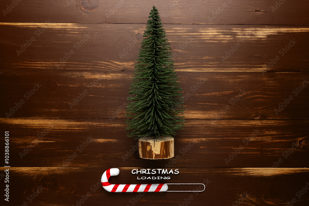 Wall mural minimal christmas loading concept. fir tree and candy cane on wooden rustic table.