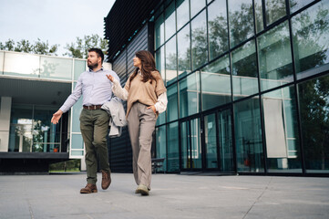 Fototapeta premium Business people walking and talking outside office building