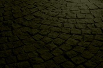Old paving stones at night in red light