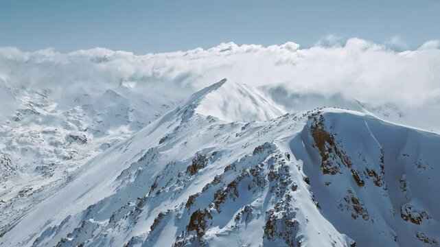 Epic Aerial Over Snowy Mountain Range Landscape At Evening Morning Summit Cold Winter Ski Vacation Existential Thoughts Nature 4k Slow Motion