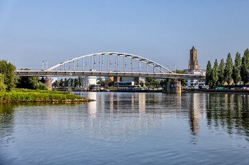 Obraz premium Arnhem, Netherlands - August 1, 2024: The John Frost Memorial Bridge over the Rhine River in Arnhem, Netherlands 