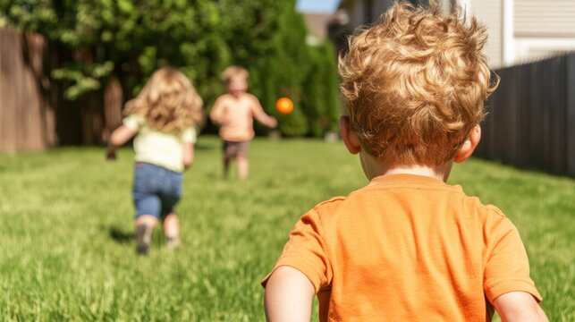 A family engaging in a game of catch in the backyard. The father throws a ball to the son while the daughter runs to catch it. Enjoying their time together and bonding as a family.