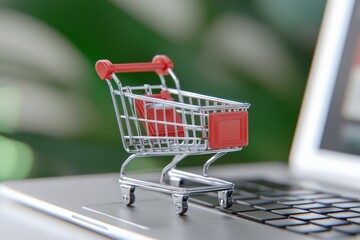 Home shopping / online shopping, e-commerce concept: Cart or trolley on a laptop screen, depicting consumers who buy goods and services over the internet