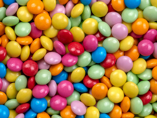multicolored round chocolate dragees. background
