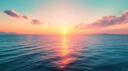 Obraz premium A serene sunset over calm ocean waters, creating a tranquil and picturesque atmosphere.