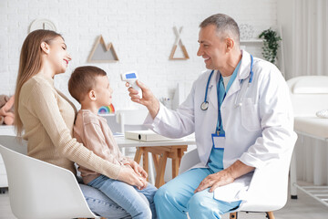 Little boy with mother at pediatrician's office