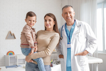 Fototapeta premium Little boy with mother at pediatrician's office