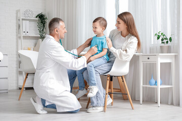 Little boy with mother at pediatrician's office