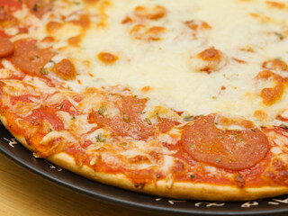 Pepperoni pizza, pizza with tomato sauce and spicy salami seasoned with paprika and chili peppers topping
