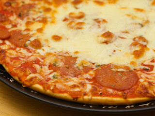 Pepperoni pizza, pizza with tomato sauce and spicy salami seasoned with paprika and chili peppers topping