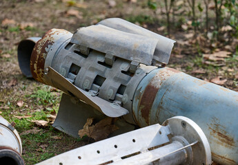 The tail section of a 220 mm rocket for the Uragan rocket fire system on a city flowerbed in Mykolaiv