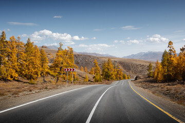 country road in autumn mountain landscape
