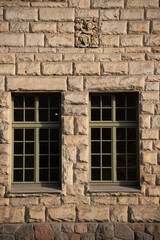 old brick wall with windows