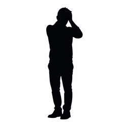 A silhouette of a person standing with their hands covering their face