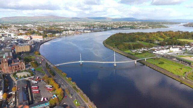 City of Derry aka Londonderry in Northern Ireland aerial view - A Beautiful Cityscape from above by the River Foyle Featuring the Beautiful Pedestrian Peace Bridge