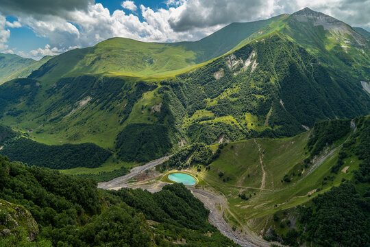 Round lake in the valley.. Devil s Valley in the Caucasus mountains. One of the most picturesque places in Georgia, close to the military road. Gudauri, Georgia 
