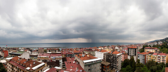 Panoramic View of Çayeli, Rize, Turkey Overlooking the Black Sea on a Cloudy Day with Coastal and Urban Scenery