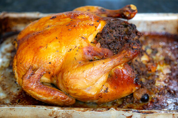 Rustic roast chicken stuffed with farofa