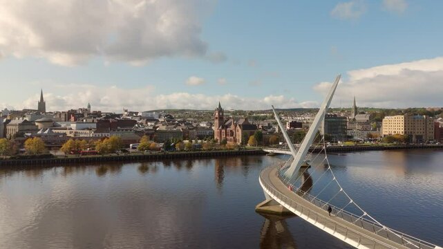 City of Derry aka Londonderry in Northern Ireland aerial view - A Beautiful Cityscape from above by the River Foyle Featuring the Beautiful Pedestrian Peace Bridge