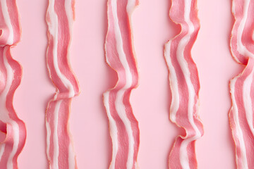 Crispy Bacon on Pastel Pink Background: A Whimsical Food Stock Photo Perfect for Blogs, Menus, and Culinary Art.