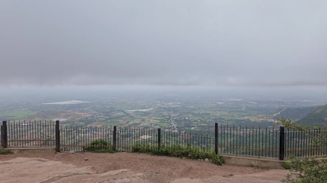 Wide Angle View of the Nani Valley from the top of the Nandi Hill with Cloudy Skies and Storm clouds
