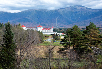 Historic Mount Washington Grand Hotel, with its distinctive red roof, overlooking Mount Washington and Presidential Range in the White Mountains of New Hampshire.