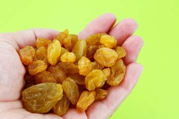 Holding a handful of sweet raisins