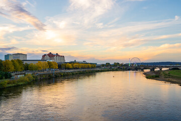 Obraz premium Dresden. Sunset. Ferris wheel is glowing. River Elbe at sunset.