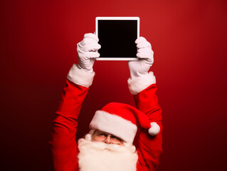 Santa's Gloved Hand Holding a Tablet Device