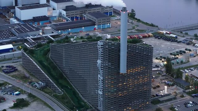 Aerial views highlight the Amager Bakke waste to energy plant in Copenhagen, Denmark, showcasing its innovative architecture and commitment to sustainable design