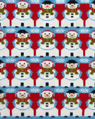 A whimsical Christmas sweater pattern of snowmen