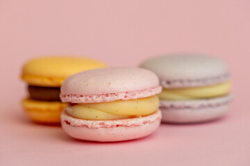 fleet of delicious almond macaroons on plain background, delicate dessert