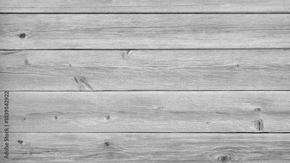 Poster a wooden background with a few small holes. the background is mostly white with some brown spots. th