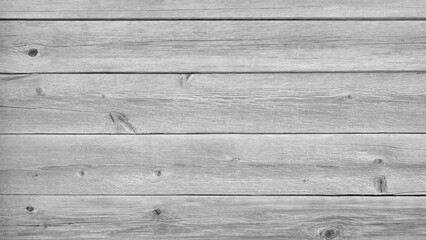 Obraz premium A wooden background with a few small holes. The background is mostly white with some brown spots. The background is a simple, clean, and natural look
