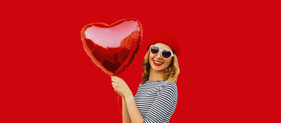 Summer, holiday, celebration, happy cheerful young woman laughing with red heart shaped balloons