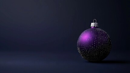 Fototapeta premium A purple Christmas ornament sits atop a dark blue surface with a white dot on top