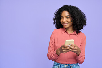 Young happy African gen z model student wearing pink shirt isolated on purple background looking...