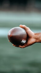 Close-Up of a Hand Gripping a Football