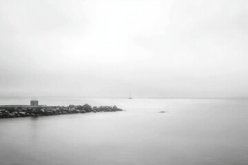 Fototapeta premium A Solitary Boat in a Foggy Harbor