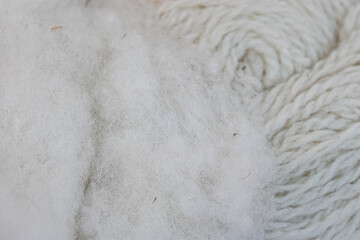 background of white animal wool for yarn and skein of white threads