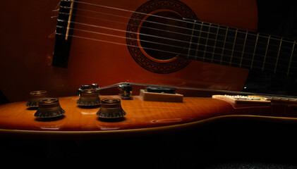 Fototapeta premium close-up photo of an electric and acoustic guitar for a musical banner background with musical instruments with free space