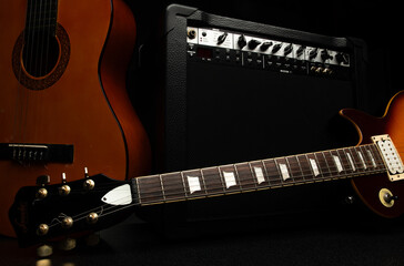 close-up photo of an electric and acoustic guitar for a musical banner background with musical instruments with free space