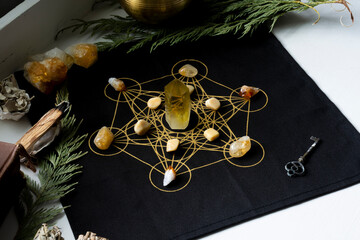 A close up image of a crystal healing grid made using citrine and tigers eye crystals. 