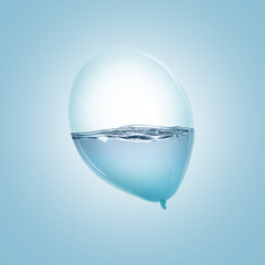 Balloon with water inside on light blue background