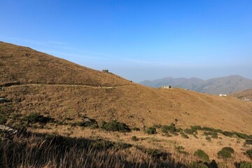 Remote Mountain Landscape with Sparse Buildings and Clear Sky, Sunset Peak, Lantau Island, Hong Kong