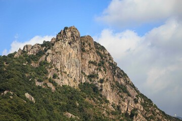 Majestic View of Lion Rock in Hong Kong Under a Clear Sky