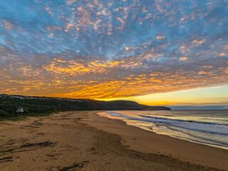 Winter seascape views over the beach with high and medium cloud cover