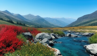 Fototapeta premium mountains and a river in the middle of a valley with red flowers