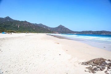 Serene Beach with Mountainous Backdrop and Clear Blue Sky, Sai Kung, Hong Kong